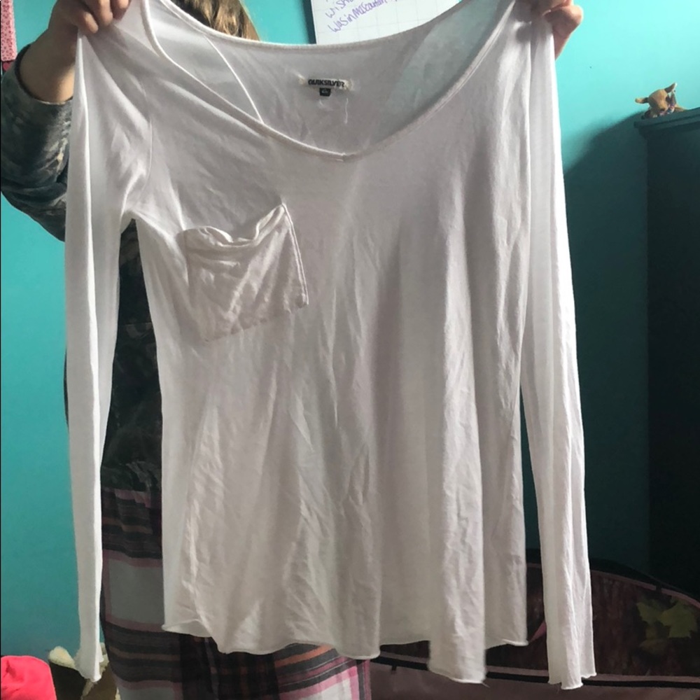 White long sleeve shirt that splits in the back